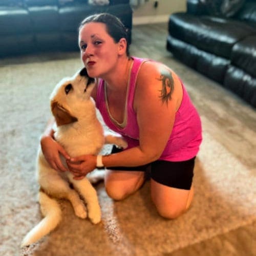 FurBabies & Friends puppy training client sophie giving kisses after puppy training.