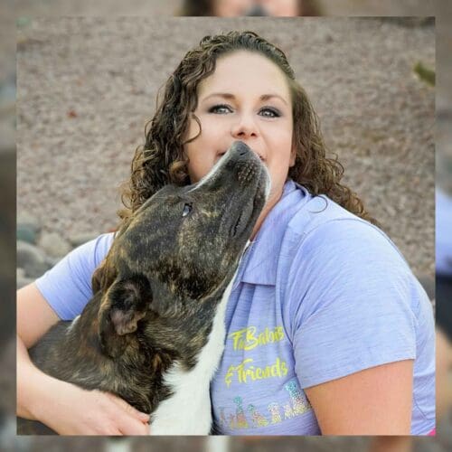 Kristie Halverson and her third foster failure, Tigger, a brindle pitbull cattle dog mix.